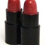 Red mini bullet lipsticks in black cases, designed for precision and quality, available at Cavalla - Equipment, Systems and Integrated Lines.